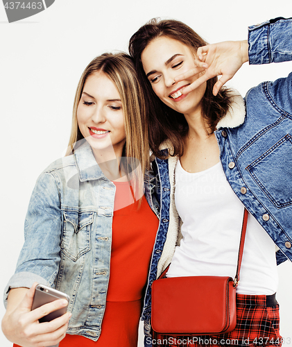 Image of best friends teenage girls together having fun, posing emotional on white background, besties happy smiling, lifestyle people concept close up