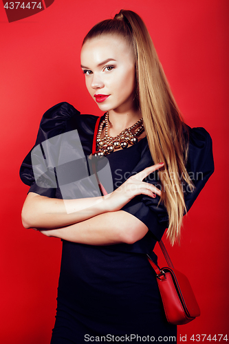 Image of young pretty woman young lady posing on red background, lifestyle people concept