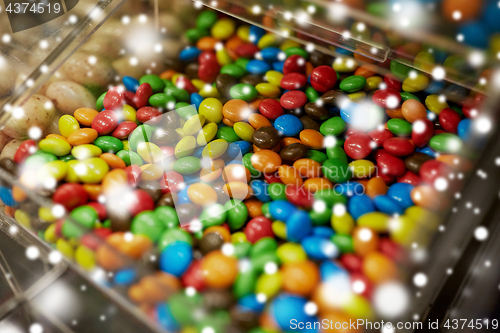 Image of close up of multicolored dragee candies in box