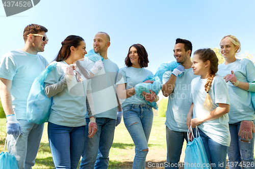 Image of group of volunteers with garbage bags in park