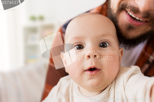 Image of close up of happy little baby boy with father