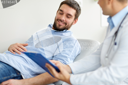 Image of doctor and man with health problem at hospital