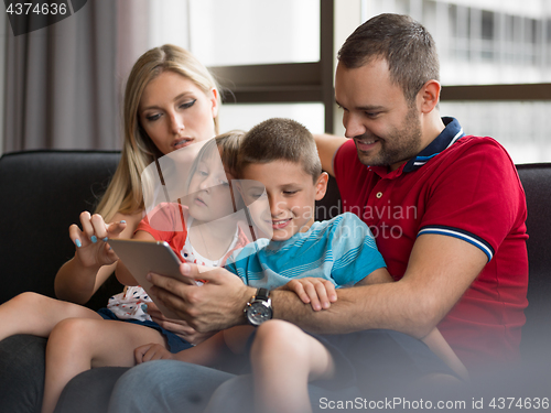 Image of young cuple spending time with kids