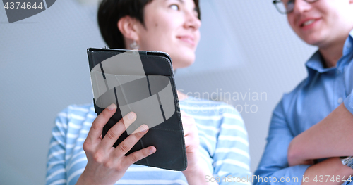 Image of low angle shot of business people using technology