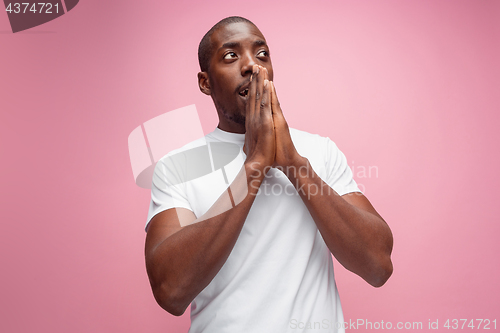 Image of Positive thinking African-American man on pink background