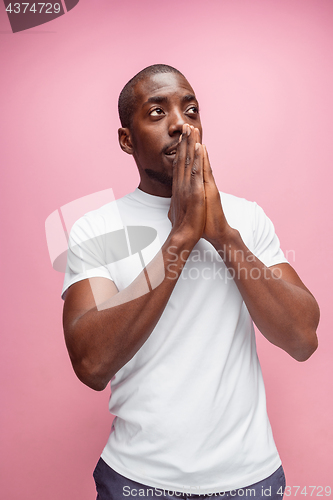 Image of Positive thinking African-American man on pink background