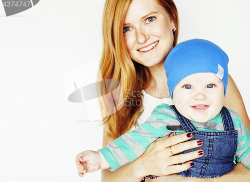 Image of young beauty mother with cute baby, red head happy modern family