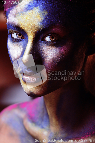 Image of beauty woman with creative make up like Holy celebration in Indi