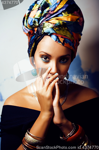 Image of beauty bright african woman with creative make up, shawl on head