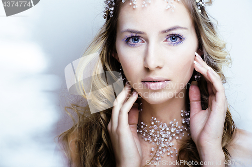 Image of beauty young snow queen with hair crown on her head, complicate 