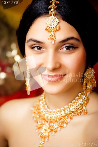 Image of beauty sweet real indian girl in sari smiling on black background