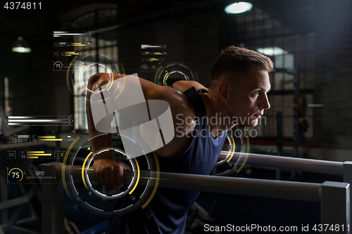 Image of man doing triceps dip on parallel bars in gym