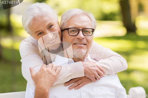 Image of portrait of happy senior couple at park