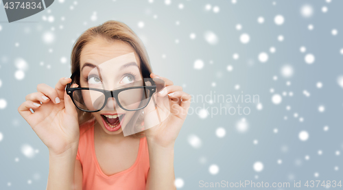 Image of happy woman or teenage girl in eyeglasses