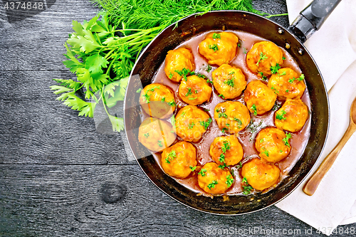 Image of Meatballs in pan on black board top