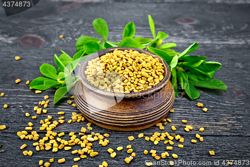 Image of Fenugreek with leaf in bowl on wooden board