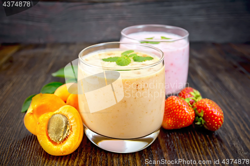 Image of Milkshake apricot and strawberry on dark board