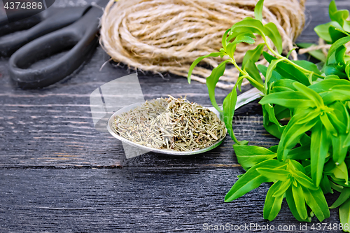 Image of Savory dry in spoon with twine on board