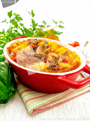 Image of Ragout of meat and vegetables in brazier on towel