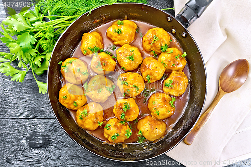 Image of Meatballs in pan on board top