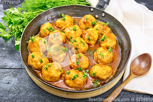 Image of Meatballs in pan with napkin on board