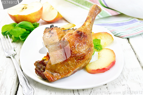 Image of Duck leg with apple on light board