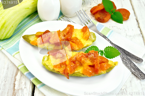 Image of Courgettes in spicy sauce with dried apricots on board