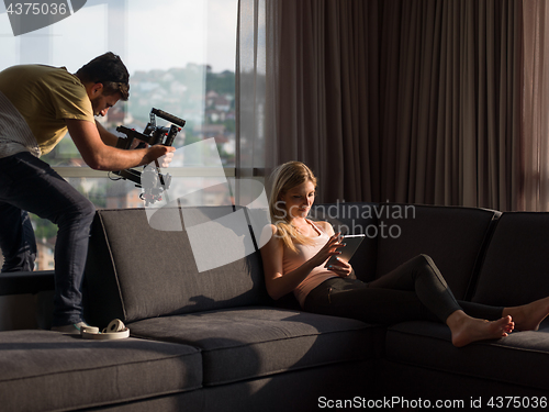 Image of Woman Using Tablet On Couch At Home
