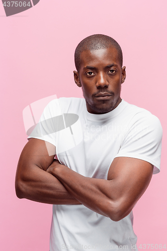 Image of Positive thinking African-American man on pink background