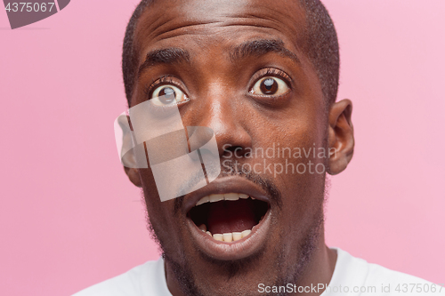 Image of The portrait of handsome young surprised black african man