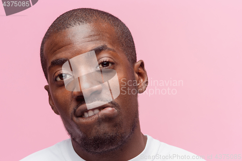 Image of Positive thinking African-American man on pink background