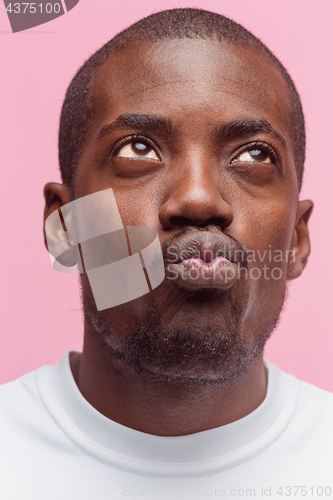 Image of Positive thinking African-American man on pink background