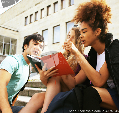 Image of cute group teenages at the building of university