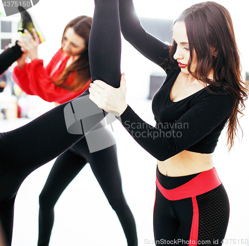 Image of Women doing sport in gym, jumping, healthcare lifestyle people concept, modern loft studio