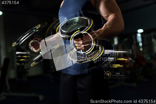 Image of close up of man with dumbbells exercising in gym