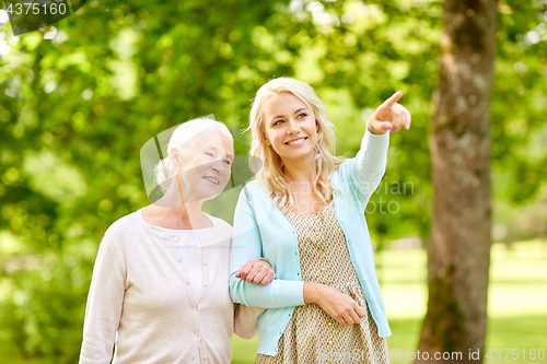 Image of daughter with senior mother at park