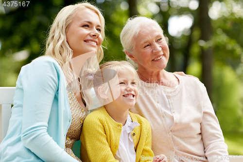 Image of woman with daughter and senior mother at park