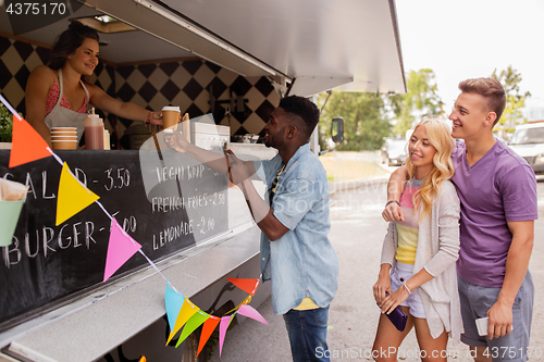 Image of happy customers queue at food truck