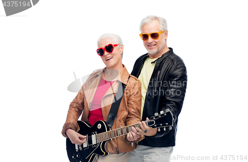 Image of senior couple in sunglasses with electric guitar