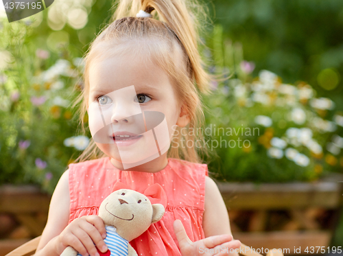 Image of portrait of happy beautiful little girl outdoors