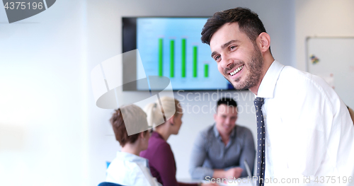 Image of Businessman using tablet in modern office