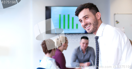 Image of Businessman using tablet in modern office