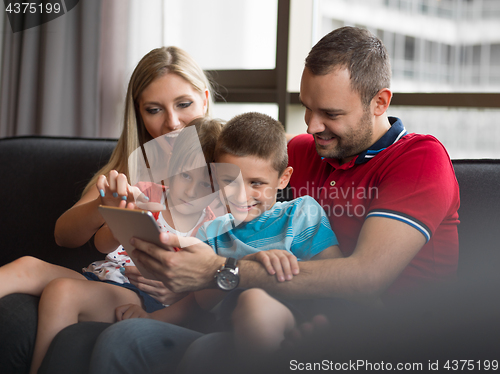 Image of young cuple spending time with kids