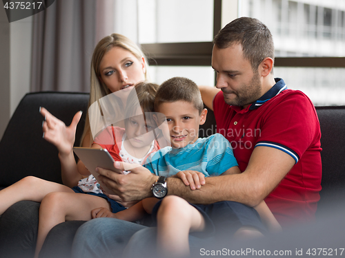 Image of young cuple spending time with kids