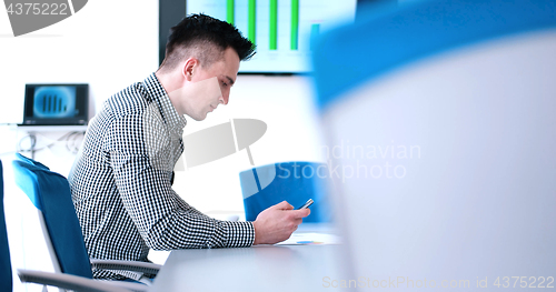 Image of Senior businessman  using cell phone at  stratup office