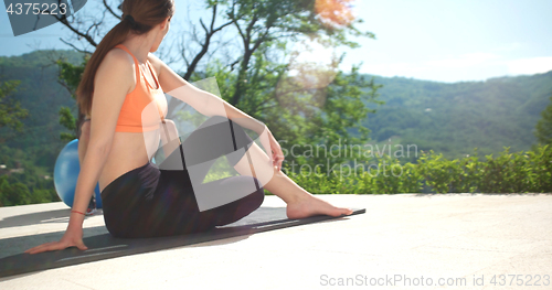 Image of Woman Doing Yoga at villa\'s terase