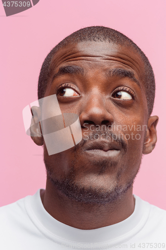 Image of Positive thinking African-American man on pink background