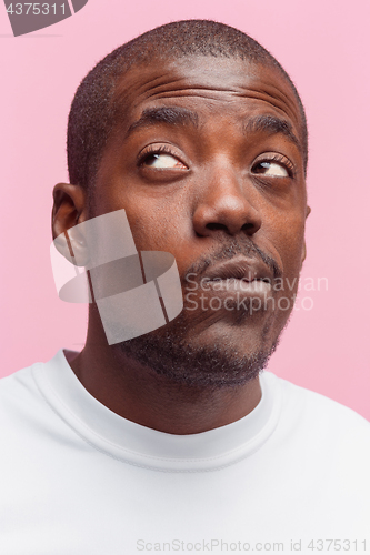 Image of Positive thinking African-American man on pink background