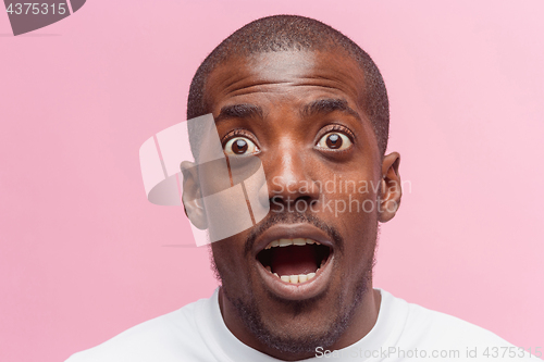 Image of The portrait of handsome young surprised black african man