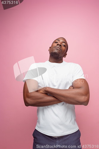 Image of Positive thinking African-American man on pink background